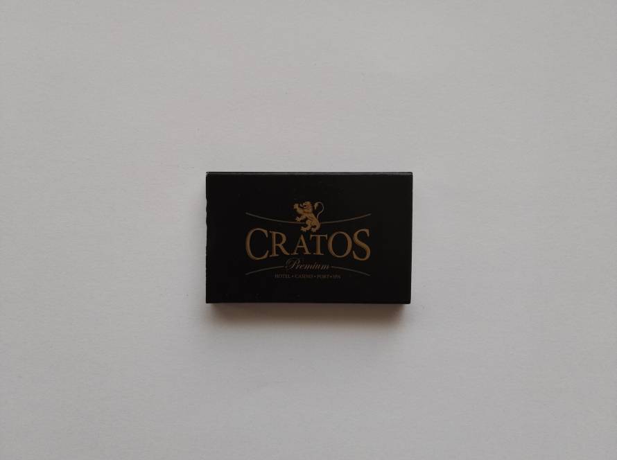 Cratos Premium Hotel Casino Port Spa luxury gold-on-black design