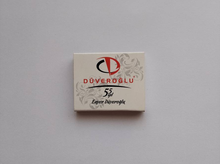 Düveroğlu 55th anniversary commemorative design with logo and ornamental pattern