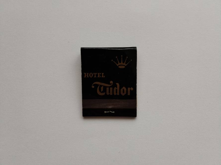 Hotel Tudor branding with crown emblem and classic typography