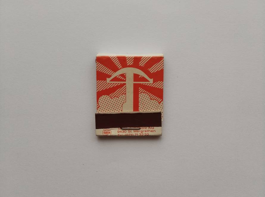 TERZA Swiss manufacturer matchbox with bold red graphic symbol on front and multilingual “Swiss Quality” text on back, mid-century industrial branding