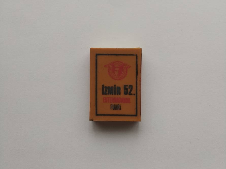“İzmir 52. International Fuarı” commemorative matchbox; orange cover with fair emblem and bilingual text. Likely produced for İzmir International Fair promotion.