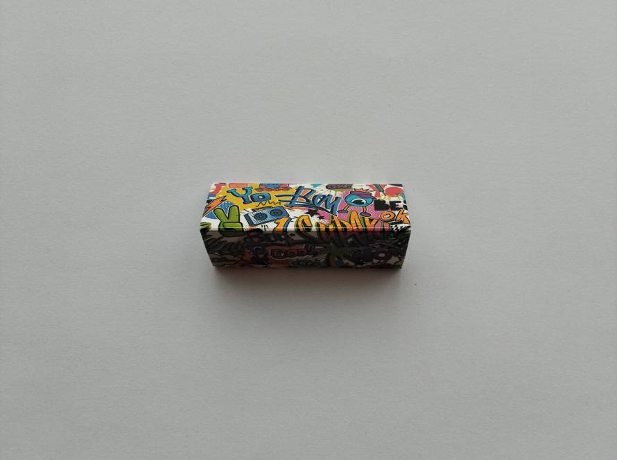 Colorful graffiti-style contemporary matchbox design with pop-art typography and comic-style graphics.