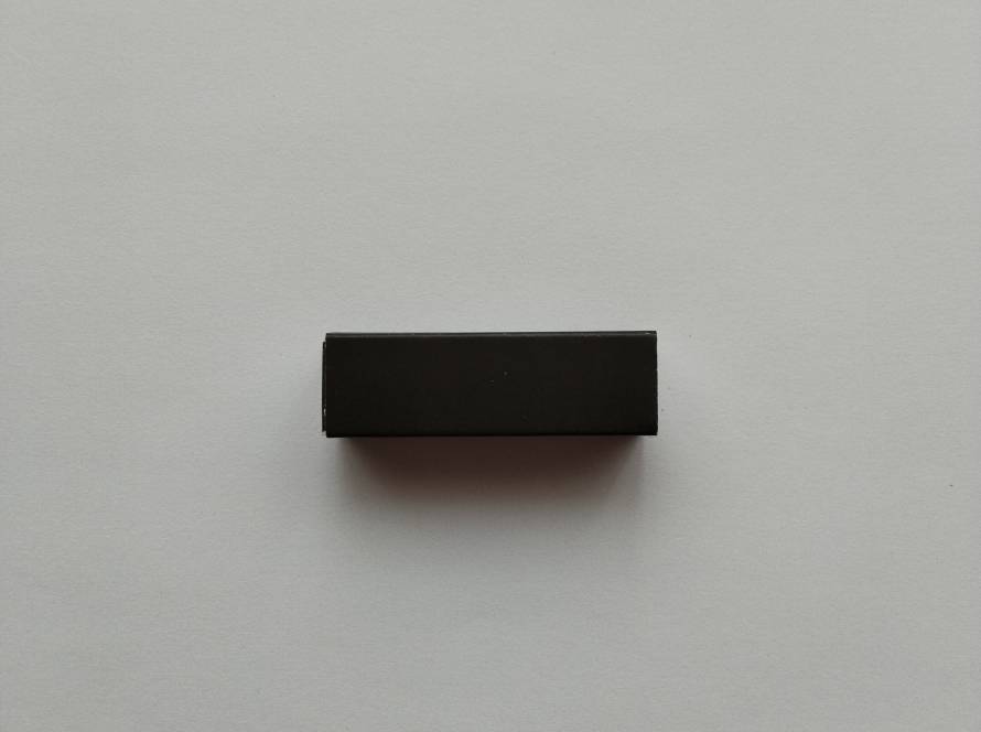 Black and red striped promotional matchbox with IMACO name and UK phone number printed on side panel.