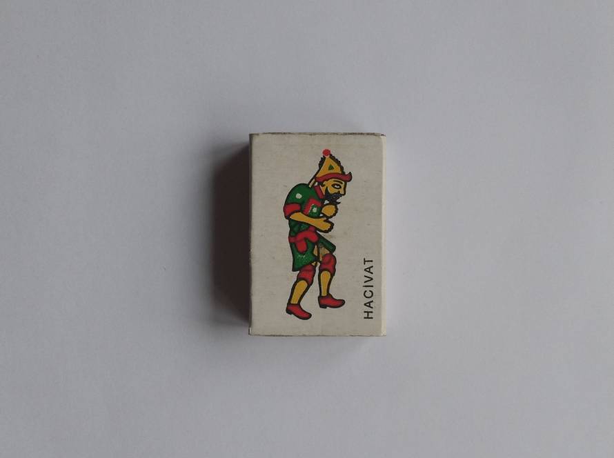 Illustrated “Hacivat” Karagöz shadow play character on cream background. Bright traditional costume colors; Turkish cultural theme collectible.