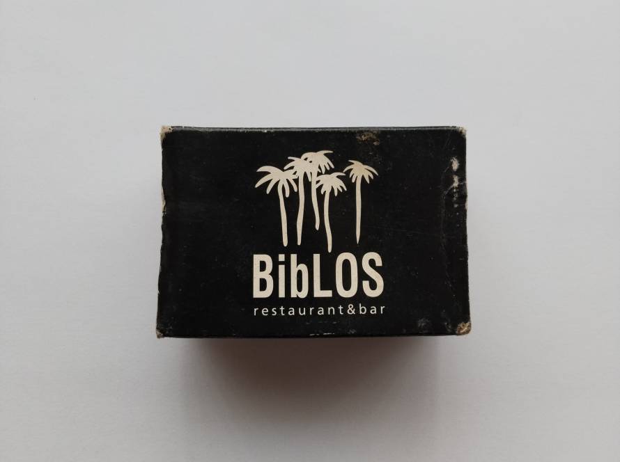 “Biblos Restaurant & Bar” black matchbox with palm tree motif. Bodrum Marina contact details printed on reverse.