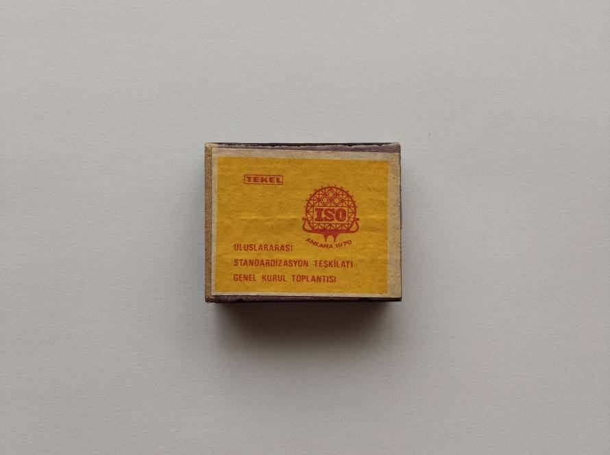 Tekel promotional matchbox for “ISO Ankara 1970 – Uluslararası Standardizasyon Teşkilatı Genel Kurul Toplantısı.” Bright yellow cover with official emblem.