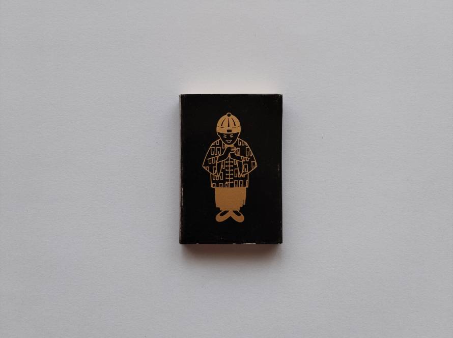Black and gold “The Mandarin Singapore” matchbox featuring stylized emblem and Chinese characters. Elegant luxury hotel branding with minimalist high-contrast design.