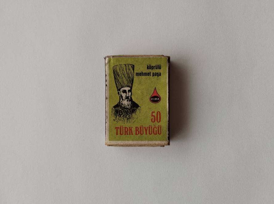 “Köprülü Mehmet Paşa – 50 Türk Büyüğü” themed CIRA matchbox. Features Ottoman Grand Vizier portrait illustration on front; reverse shows stylized buffalo artwork. Part of Turkish historical personalities series.