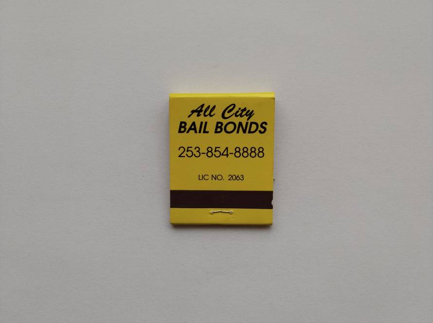 Promotional matchbook for All City Bail Bonds, Kent, Washington (USA), featuring business address and contact number. Typical American local service advertising matchbook.