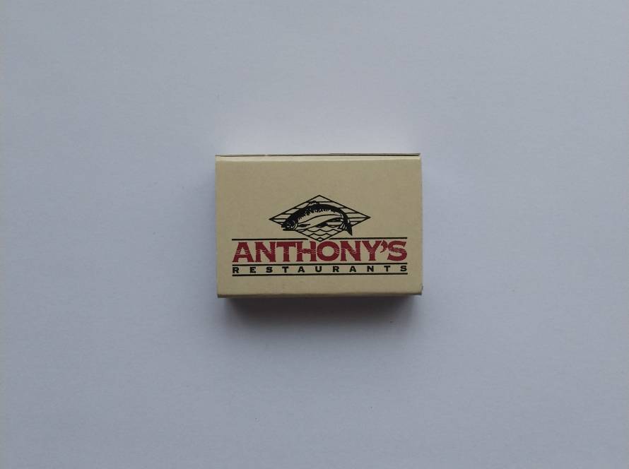 Matchbox for Anthony’s Restaurants, featuring fish logo. Represents a well-known American seafood restaurant chain.