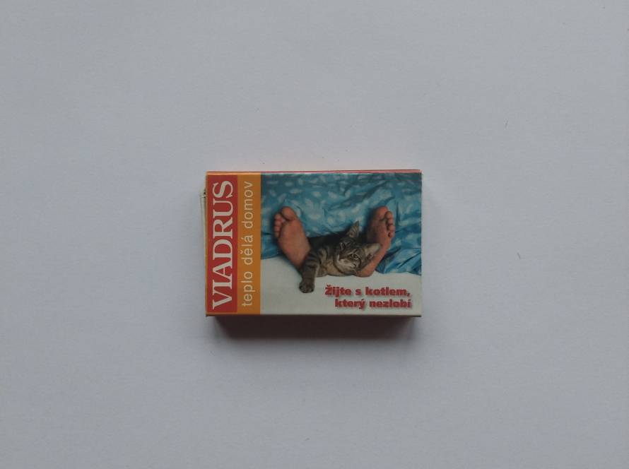 Promotional matchbox for Viadrus heating systems (Hercules U26, Prometheus). Includes product visuals and slogan, representing industrial marketing material.