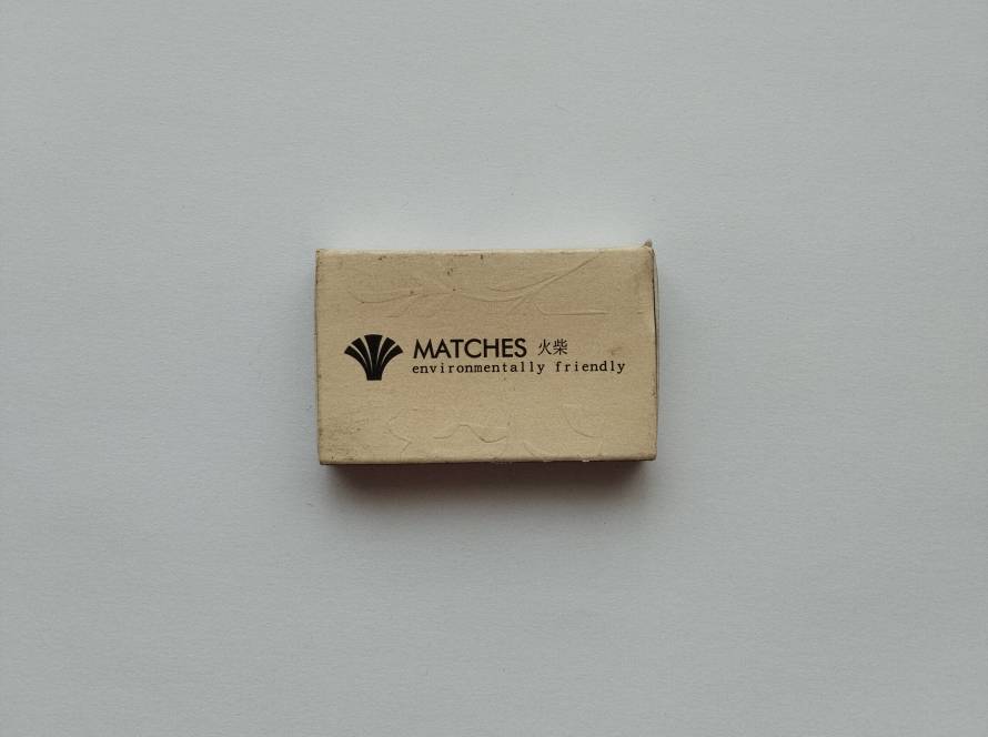 Worn version of environmentally friendly matches box with visible creases and aging; authentic used vintage condition.