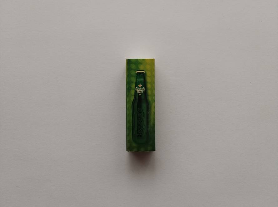 Carlsberg Beer promotional matchbox with green bottle graphic and “Join the Club” slogan, showcasing bold brand-centric design typical of early 2000s global beverage marketing.