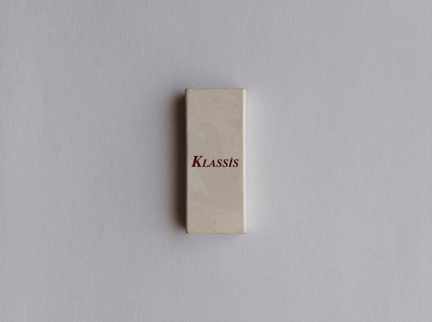 Minimalist “Klassis” branded matchbox with elegant typography.