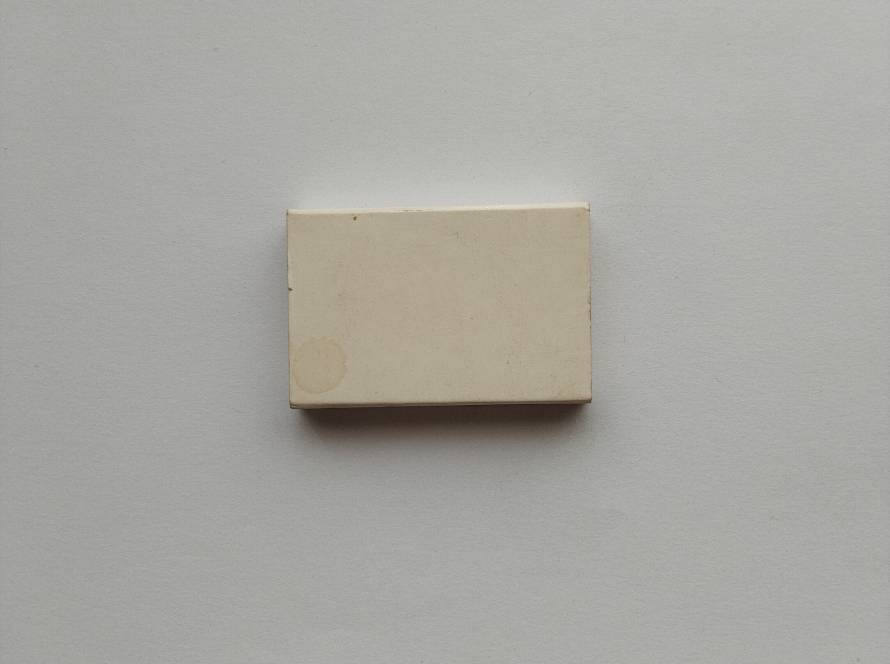 Plain unbranded vintage matchbox with signs of wear. Likely generic production; low collectible value unless part of bulk lot.