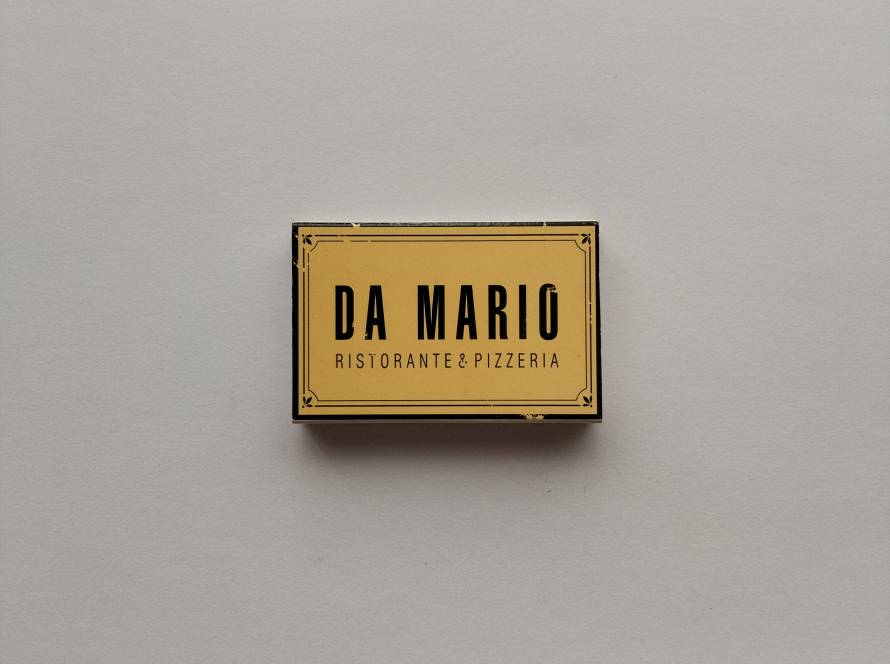 Da Mario Ristorante & Pizzeria branded matchbox with minimalist vintage typography.