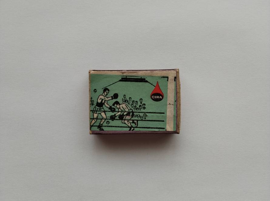 Dynamic boxing scene illustration with audience; sports-themed vintage design.