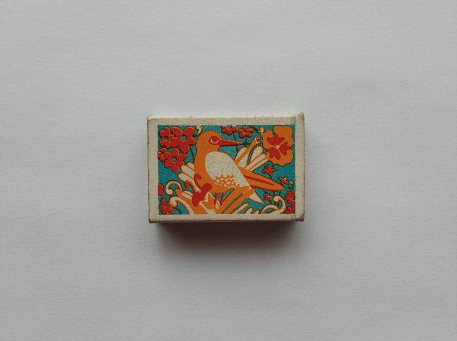 Vibrant bird and floral motif; eye-catching decorative design with retro color palette.