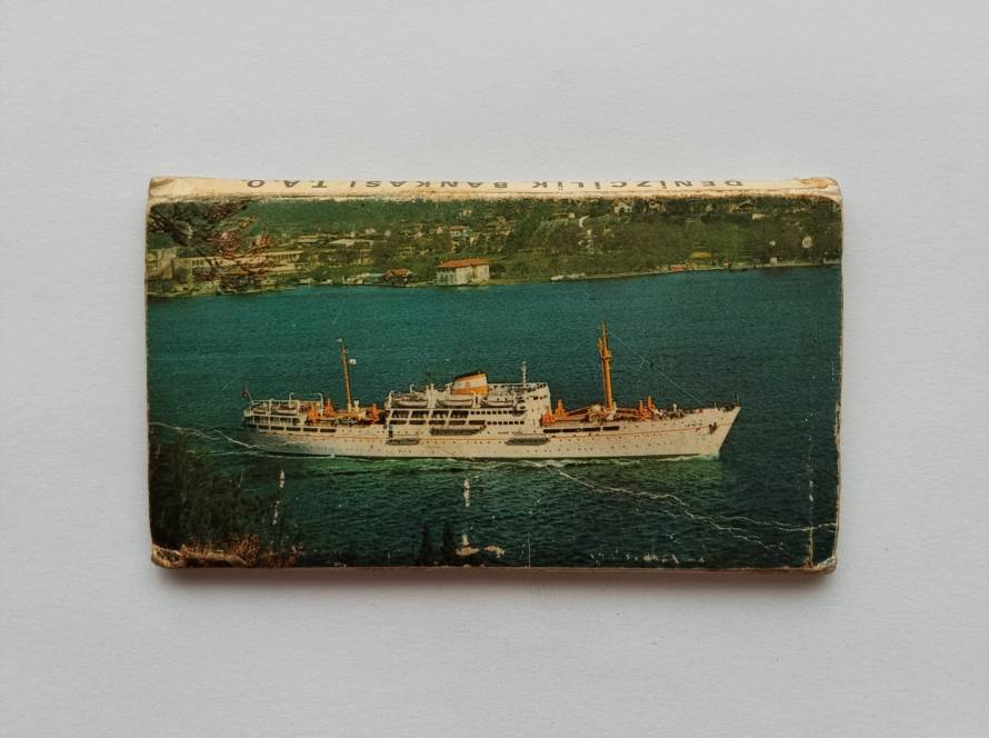 Passenger ship illustration (Denizcilik Bankası); maritime-themed collectible.