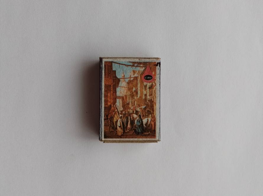 Detailed illustration of a lively Ottoman street market scene with people and architecture. Branded with CIRA logo.