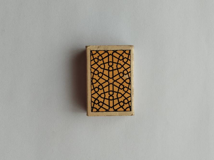 Traditional Anatolian kilim motif rendered in brown and yellow geometric textile-inspired design.