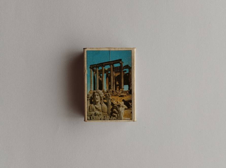 İnci branded collectible matchbox featuring Kütahya Zeus Temple ruins photograph; bilingual reverse text reads “Temple of Zeus.”