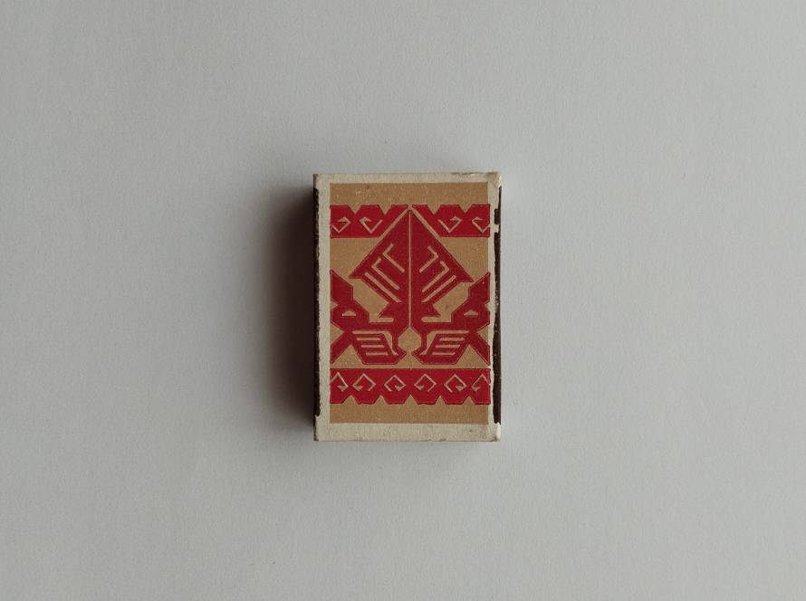 Vintage Türkay matchbox featuring bold red Anatolian geometric motif artwork on beige background with minimalist retro styling.