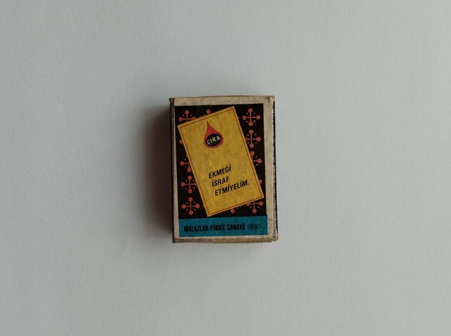 Malazlar Cıra matchbox carrying the social awareness slogan “Ekmeği İsraf Etmeyelim.”