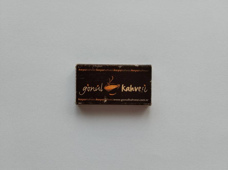 Advertising matchbox for Gönül Kahvesi coffeehouse. Features branding and website details, reflecting modern café marketing collectibles.