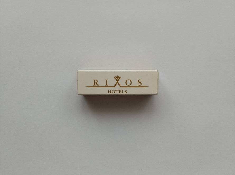 Rixos Hotels branded promotional matchbox. Premium hospitality advertising collectible from a well-known hotel chain.