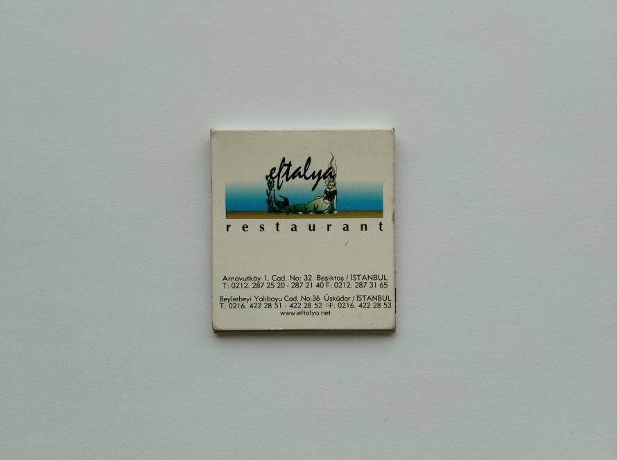 Eftalya Restaurant promotional matchbox displaying restaurant branding, branch addresses and contact details in Istanbul.