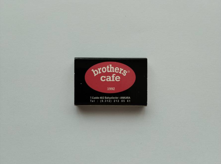 Brothers Cafe promotional matchbox featuring Kızılay, Ankara branch information and café branding established in 1992.