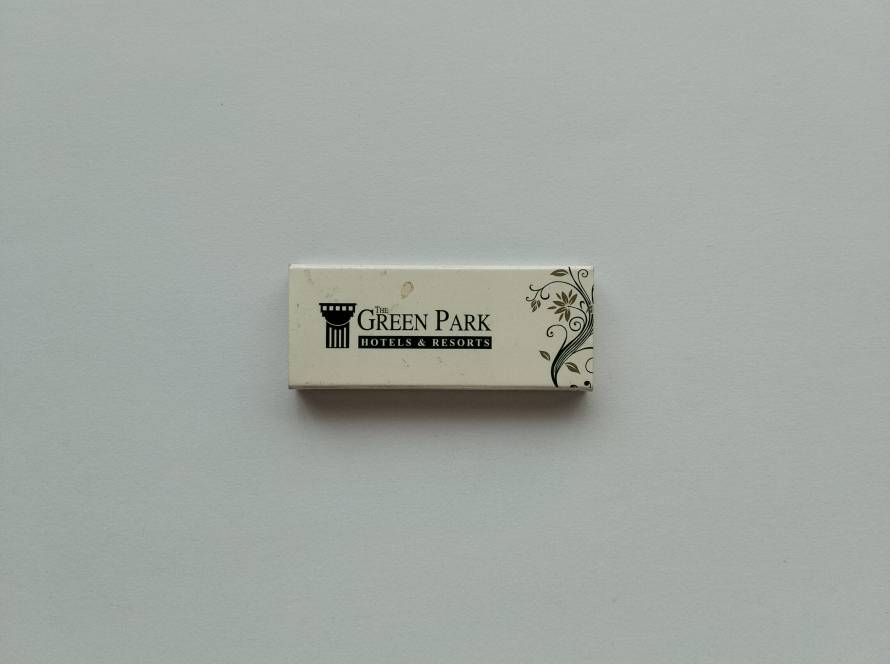 The Green Park Hotels & Resorts promotional matchbox featuring hotel branding, website and reservation contact information.