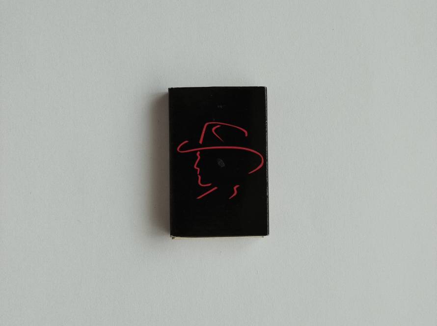 Kashmere branded promotional matchbox featuring simple black-and-orange fashion retail branding.