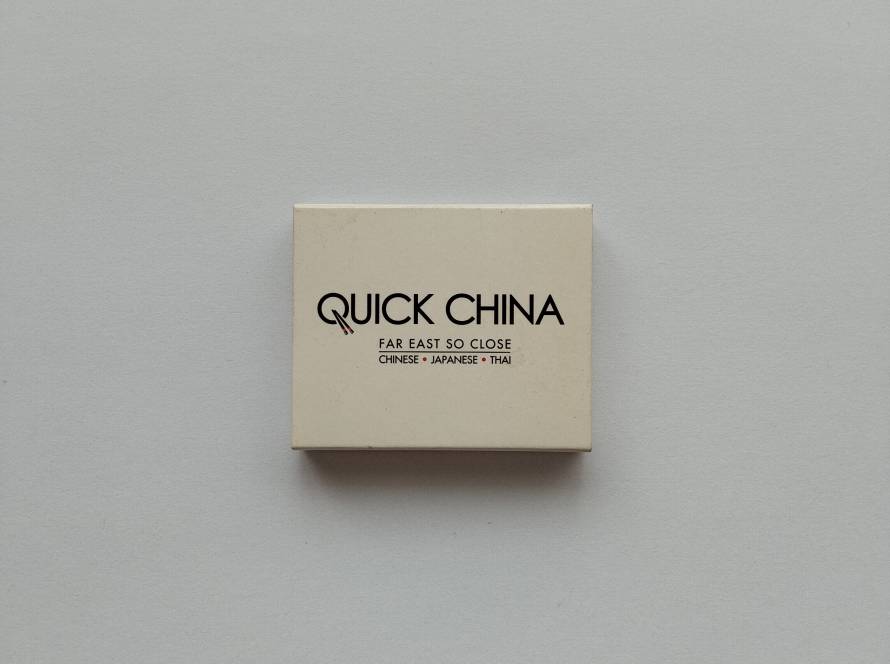 Quick China restaurant chain promotional matchbox with multiple branch locations listed. More desirable than generic restaurant issues due to chain recognition.