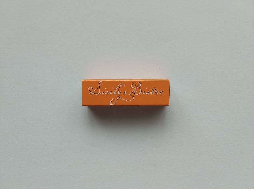 Sicily's Bistro promotional matchbox featuring branding, website and branch contact numbers for Karum, Bahçelievler and Çankaya locations. A modern café and restaurant advertising matchbox from Ankara.