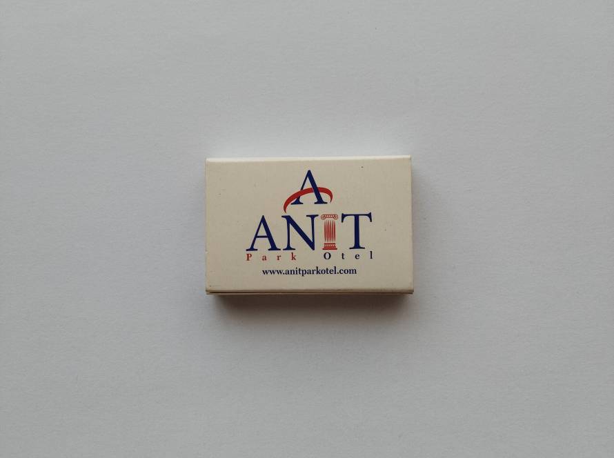 Promotional matchbox for Anıt Park Hotel, displaying hotel branding, website information, and hospitality advertising.