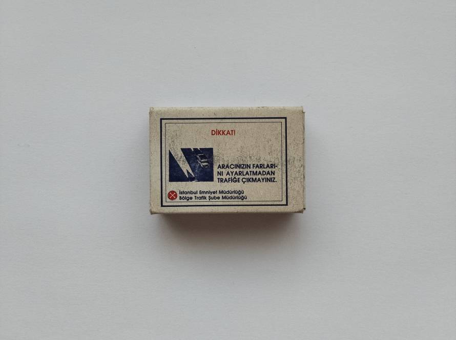 Malazlar matchbox issued in cooperation with İstanbul Traffic Police, reminding drivers to adjust vehicle headlights before entering traffic; reverse includes Pendik production information.
