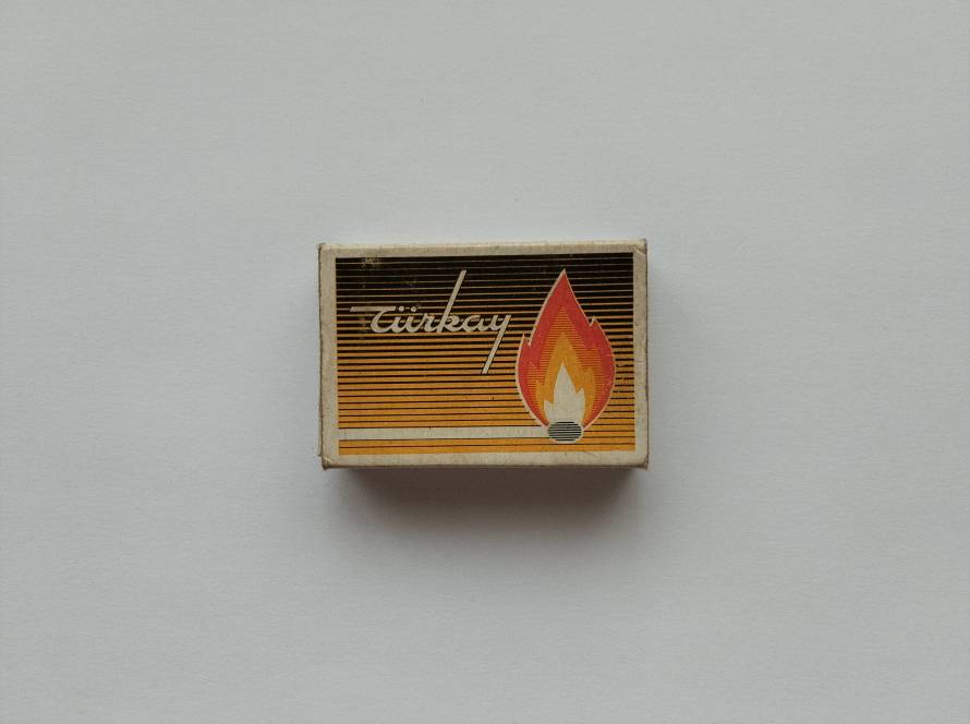 Vintage Türkay quality matchbox featuring stylized flame illustration and striped graphic design.
