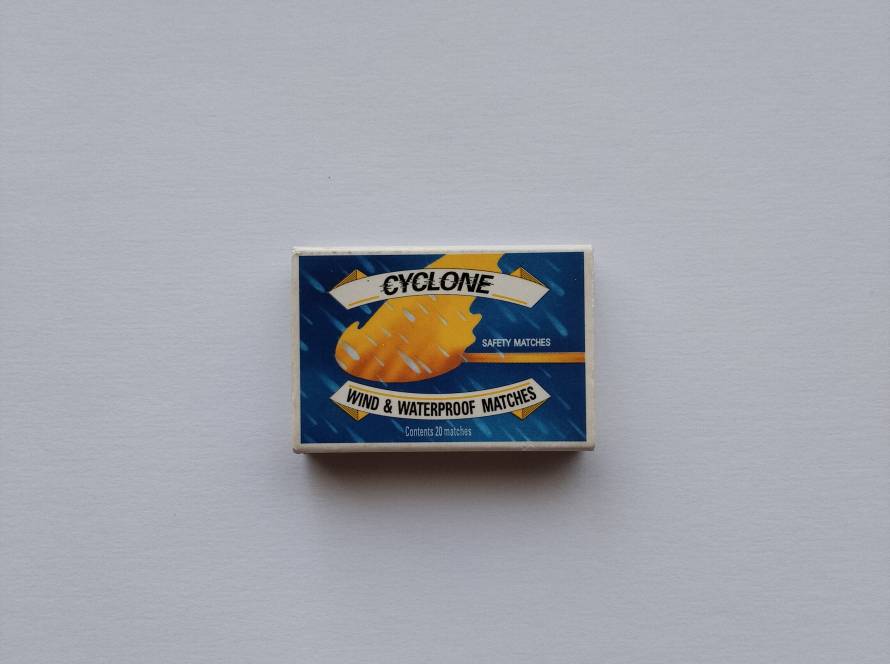 Cyclone wind & waterproof safety matches. Front features a storm-themed design with "Wind & Waterproof Matches." Reverse identifies it as A Swedish Match Product – Made in Hungary with multilingual descriptions, making it a practical outdoor and camping matchbox collectible.