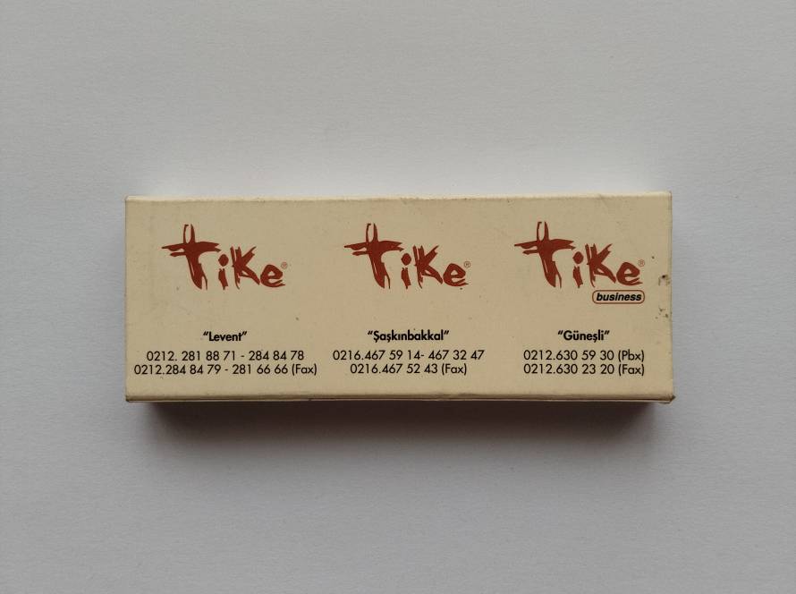 Promotional matchbox for Tike Business restaurant, listing the Levent, Şaşkınbakkal, and Güneşli branches in Istanbul with contact information. Clean minimalist design with light age-related wear and slight surface marks.