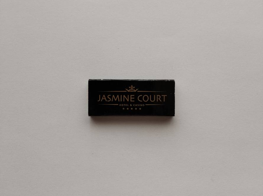 Promotional matchbox for Jasmine Court Hotel & Casino, one of Northern Cyprus' best-known luxury casino hotels. Attractive black-and-gold design.