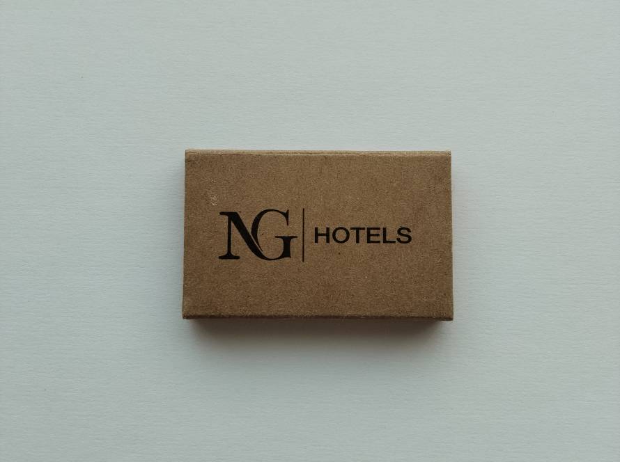 Promotional matchbox for NG Hotels, featuring a minimalist kraft-paper design with the hotel's modern logo. Eco-friendly corporate branding piece collected from the Turkish hospitality industry.